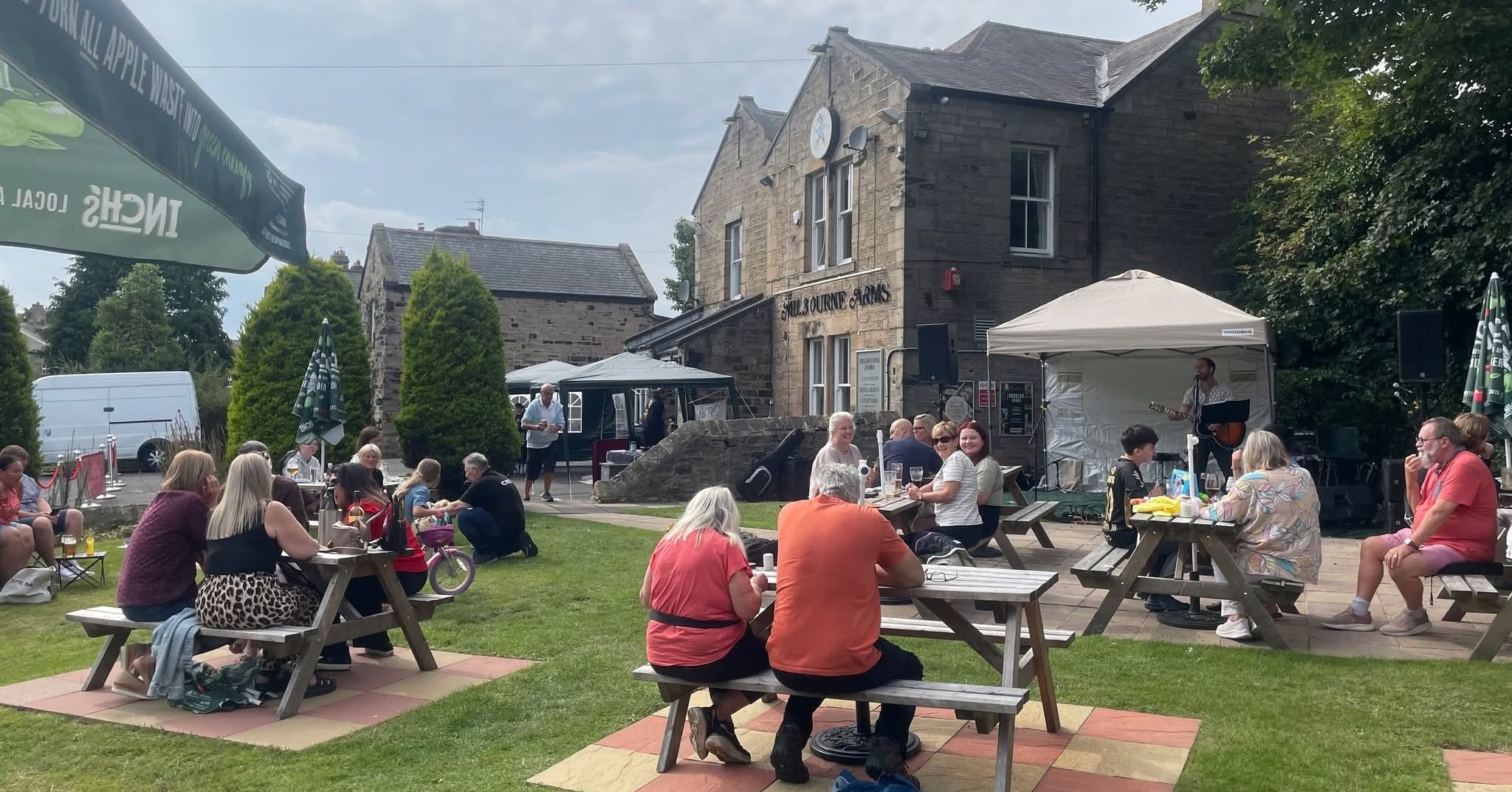 A performer playing outside The Milbourne Arms during MilliFest